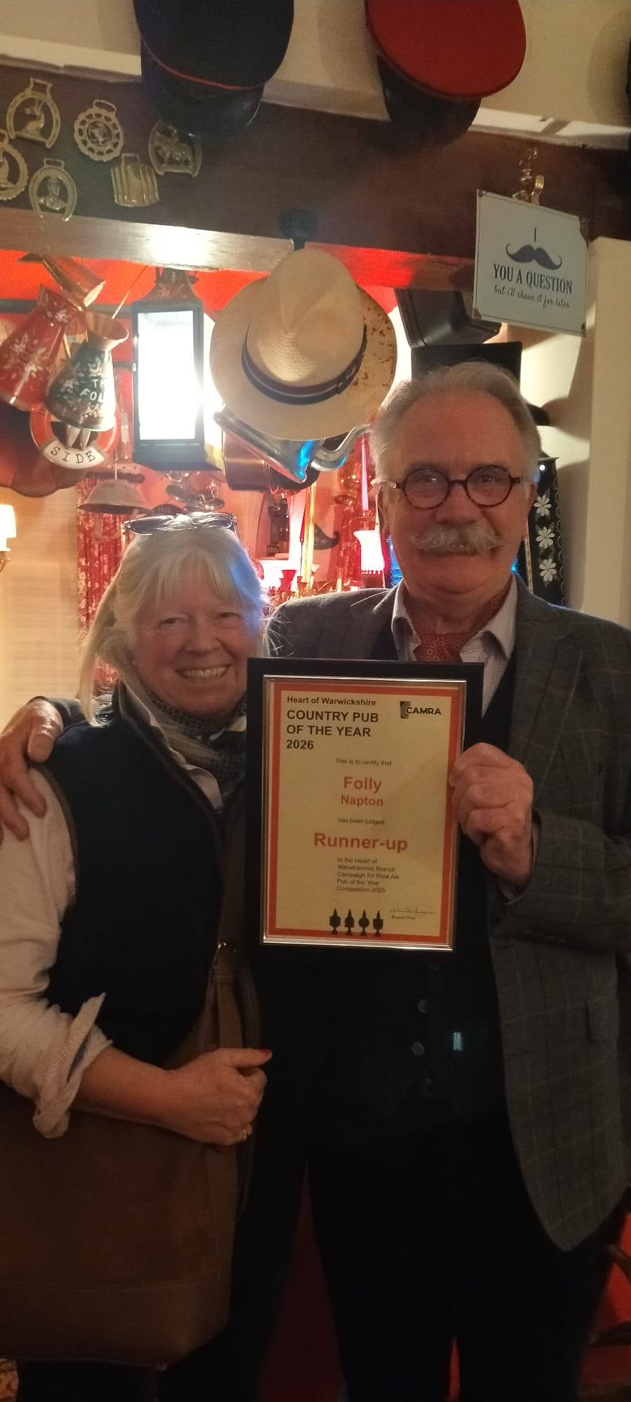 Mark and Caroline receiving CAMRA award for runner-up for best country pub in Warwickshire